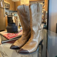 Vintage stunning tan leather Justin cowboy boots with brown tip.  Size 5.5A.  Solid vintage condition but show signs of obvious wear. Vintage Almond Toe Boots For Ranch, Western Brown Heeled Boots With Almond Toe, Vintage Pointed Toe Boots For Western Events, Western Almond Toe Boots For Western-themed Events, Vintage Heeled Boots For Rodeo With Round Toe, Vintage Pointed Toe Boots For Western-themed Events, Vintage Leather Heeled Boots For Western Events, Western Style Vintage Brown Boots For Rodeo, Vintage Snip Toe Heeled Boots For Western Events