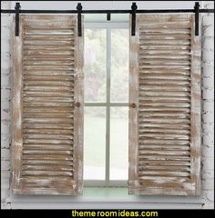 an open window with wooden shutters and white brick wall