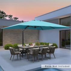 an outdoor dining table and chairs near a swimming pool