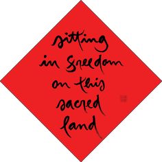 a red square with the words sitting in freedom on it's side and an image of