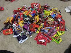 a pile of assorted candy on the floor