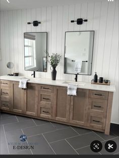 a bathroom with two sinks and mirrors on the wall