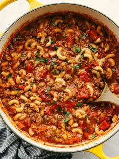 a large pot filled with pasta and sauce