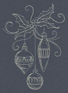 an embroidered christmas ornament hanging from a ribbon on a dark blue fabric background