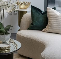 a living room filled with furniture and flowers