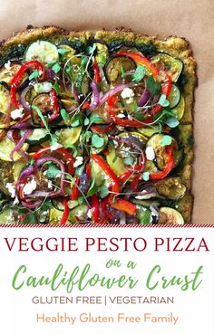 vegetable pesto pizza on a cauliflower crust with text overlay that reads, veggie pesto pizza on a cauliflower crust