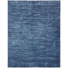 a blue rug with an abstract design