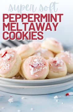 a white plate topped with cookies covered in powdered sugar