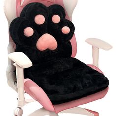 a pink and black stuffed animal chair cushion