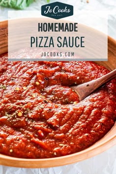 homemade pizza sauce in a bowl with a wooden spoon on the side and text overlay that reads homemade pizza sauce