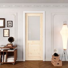 a living room with white walls and wooden floors