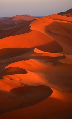 sand dunes in the desert at sunset