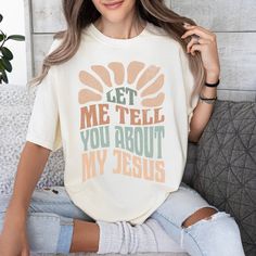 Celebrate your faith with the Let Me Tell You About My Jesus T-Shirt. This ivory shirt features a cool boho design and proudly shares your love for Jesus. Perfect for spreading His message and starting conversations about your faith. Features: 100% USA Cotton Preshrunk Sizing is unisex & true to size. Size up for an oversized fit. Color: Ivory Super cozy & will hold their shape wash after wash.(Machine wash cold & tumble dry Christian Tshirt Design Ideas Vinyl, White Bohemian T-shirt With Letter Print, Jesus Tshirt Design, Starting Conversations, Christian Outfits, Anne Wilson, My Jesus, Christian Tee Shirts, Christian Tshirt Design