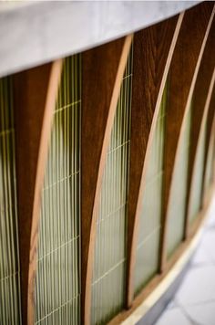 close up view of wood and glass panels on a building's side window sill