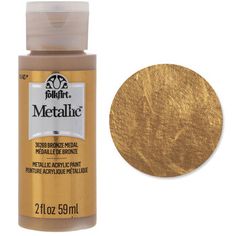 golden metallic paint bottle with white background