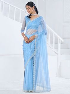 This saree is crafted from luxurious organza material in a captivating sky-blue color with intricate Swarovski work all over. The saree is adorned with a heavy handwork border, adding a touch of sophistication and elegance to the overall look. Paired with a matching organza blouse featuring zircon work, this ensemble is perfect for receptions, parties, festivals, or any special occasion.
This saree includes its gorgeous sky-blue color that exudes charm and elegance. The Swarovski work all over t Light Blue Saree, Organza Saree With Blouse, Engagement Gown, Lehenga Crop Top, Stitched Saree, Powder Blue Color, Lehenga Choli Wedding, Floral Lehenga, Party Wear Lehenga Choli