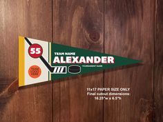 a pennant with the number 55 on it hanging from a wooden wall that says team name alexander