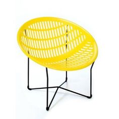 a yellow chair sitting on top of a black metal stand with an iron frame around it