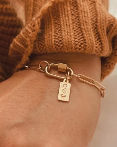 "Personalize the Tag with an Initial or symbol. It makes a fantastic, thoughtful gift for the ladies in your life.  Item Details:  * This listing is for (1) Paperclip Charm Bracelet with a Tag. * Chain: 14K Gold Filled, Tag: 14k Gold Filled, Carabiner Clasp: Sterling Silver with Yellow Gold Plating. * When you order \"Just a Bracelet\", you will only receive the bracelet and carabiner. The package will not include any charms or a Tag. Collect your favorite charms to connect to the Carabiner Clas Gold Filled Charm Bracelet, Modern Charm Bracelet, Carabiner Bracelet, Her Birthday Gift Ideas, Paperclip Bracelet, Bracelet Pendant, Gift For Her Birthday, Jewelry Lookbook, Personalized Gifts For Her