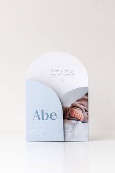 a card with an image of a baby's feet and the word abe on it