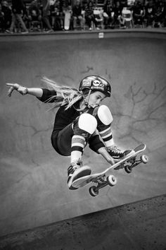 a skateboarder is in mid air doing a trick at a skateboarding park