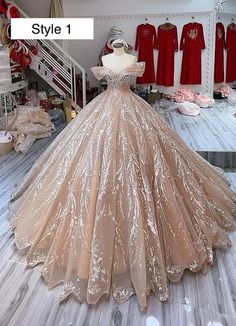 a dress on display in a store with other dresses and gowns behind the mannequin