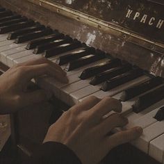 a person playing the piano with their hands