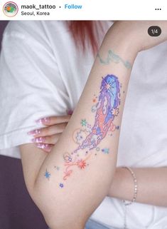 a woman with a tattoo on her arm