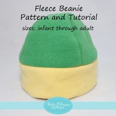 a green and yellow beanie hat sitting on top of a white surface with text overlay that reads fleece beanie pattern and tutor sizes instant through adult