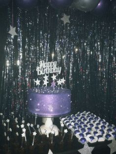 a purple birthday cake with stars on it