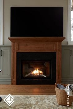 Wormy maple fireplace mantel and surround with grey-toned cabinetry in traditional farmhouse living room. Gettysburg Gray, Maple Mantle, Living Room Styles Traditional, Traditional Farmhouse Living Room, Surround Fireplace, Fireplace Renovation, Oak Bathroom Cabinets