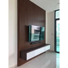 a flat screen tv mounted to the side of a wall