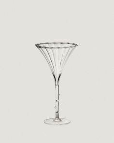 an empty wine glass sitting on top of a table