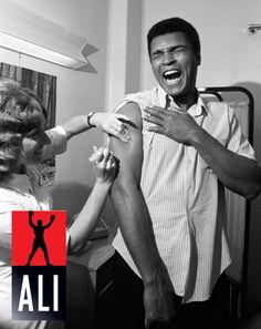 a man with his arm wrapped around a woman's leg and the words ali on it