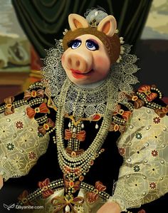 a cartoon pig dressed in an elaborate dress