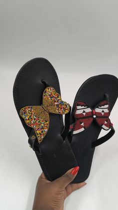 Beautifully crafted sandals made with fine beads and 100% pure leather. The sandals are very comfortable when worn and the finishing is excellent. It is such a perfect gift for you or a loved one . We can customize for you to any colour. Also sold in bulk at very good discount. Thank you for visiting our shop! Beach Slip-on Wedge Sandals With Leather Sole, Leather Sole Slip-on Wedge Sandals For Beach, Slip-on Wedge Sandals With Leather Sole For Beach, Leather Toe Post Slippers For The Beach, Leather Sandals With Removable Insole For Festivals, Multicolor Open Toe Slippers, Adjustable Leather Slippers, Leather Wedge Sandals With Single Toe Strap For Beach, Traditional Open Toe Sandals With Removable Insole