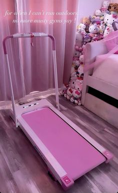 a pink treadmill with hello kitty stuffed animals in the background