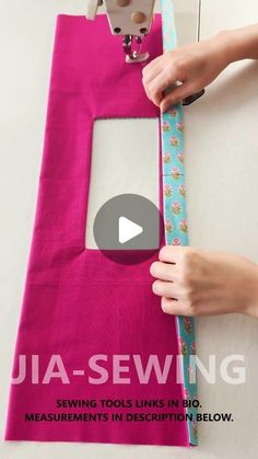 someone is using a sewing machine to sew on a pink fabric with the video below it