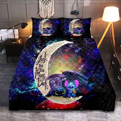 a bed with an image of a cat on the moon