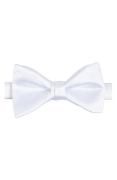 Bring versatility and distinction to any formal look with this pre-tied bow tie crafted in a solid color from smooth and silky satin. 2 1/4" width 22" length Pre-tied; adjustable 100% polyester Dry clean Imported Pre-tied Satin Bow For Black Tie Events, Solid Color Standard Tie Satin Bow, Classic Pre-tied Satin Bow Tie, Classic White Bow For Black Tie Occasions, Elegant White Bow Tie For Black-tie Events, Classic White Bow For Formal Occasions, Classic Solid Color Bow With Ties, Elegant Solid Color Bow With Tie Back, Elegant Solid Color Bow For Wedding