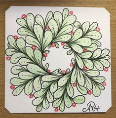 a drawing of a green wreath with red berries on it and the word art written below