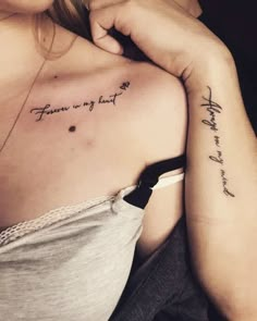 two women with tattoos on their arms and one has the words from my heart written in cursive writing