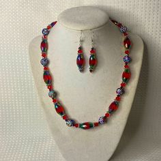 A Unique One Of A Kind Set Featuring Red Iridescent Marquis Shaped Glass, Round Glitter Rainbow Beads, And Crystals. Finished With A Pewter Clasp And Measures 18” Long. The Earrings Are In Sterling Silver And Measure 1.25” Long. Fun And Sparkly! Red Beaded Christmas Jewelry, Red Round Beads Jewelry For Festive Occasions, Festive Red Round Beads Jewelry, Red Christmas Jewelry With Colorful Beads, Red Jewelry For Christmas Celebration, Red Round Beads Jewelry For Christmas, Handmade Glass Jewelry For Festive Occasions, Red Spacer Beads Jewelry Gift, Red Spacer Beads Jewelry As Gift