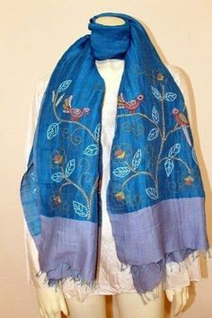 Discounted from $49.07 This is a super soft scarf, stole made from handwoven pure cotton linen. It has been hand embroidered in floral and bird on branch motifs and has hand knotted fringes on both ends of the stole. This adds a beautiful detail to the scarf and also prevents threads from coming out from edges. A versatile scarf that would fit both formal and informal occasions. Material = pure handwoven cotton (50%) and pure handwoven linen (50%) Size = 24 inch width x 70 inch length OR 60 cm x Winter Festive Embroidered Scarves, Festive Embroidered Silk Scarves, Blue Bohemian Embroidered Scarves, Traditional Silk Scarf For Spring, Bohemian Blue Dupatta With Embroidered Border, Bohemian Embroidered Silk Scarves, Traditional Blue Handloom Shawl, Bohemian Blue Handloom Dupatta, Blue Bohemian Shawl For Festivals