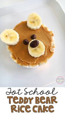 a bear face made out of peanut butter and banana slices on top of rice cake