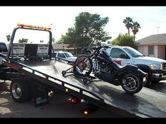 a motorcycle on the back of a flatbed trailer