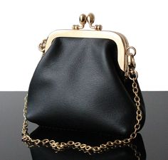 This Small Black handbag in soft real leather with Golden frame kisslock made in France. This purse is unique creation of Our collection of Wedding purse and Evening bags. Only a real leather and genuine leather and 100% handmade wormanship. The Evening bag  with clasp from the Olga's Luxury Creation are more than a singular wallet, you can use as a makeup bag ! Some Evening bag  or wallet are can also used as a small pouch.  You will enjoy quality materials (genuine leather, real leather, wool, Luxury Pouch Bags For Evening, Luxury Evening Bags With Leather Strap, Luxury Elegant Clutch Shoulder Bag, Handmade Luxury Evening Bag, Luxury Trendy Evening Bag, Luxury Trendy Evening Wallets, Luxury Wedding Clutch Shoulder Bag, Luxury Elegant Evening Shoulder Bag, Elegant Luxury Evening Shoulder Bag