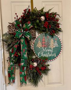 a christmas wreath hanging on the front door