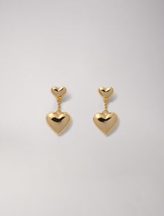 Heart earrings | Maje US Chic Gold Heart Earrings With Heart Charm, Chic Gold Heart Earrings With Charm, Gold Metal Earrings With Heart Charm, Gold Double Heart Metal Earrings, Gold Metal Double Heart Earrings, Yellow Gold Heart Charm Earrings, Elegant Gold Heart Earrings In Brass, Yellow Gold Heart Earrings With Charm, Yellow Gold Earrings With Heart Charm