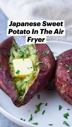 two baked potatoes on a plate with butter and parsley